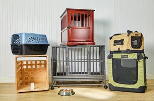 Stacked dog crates we recommend displayed on a wooden floor