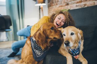 Woman playing with her dogs