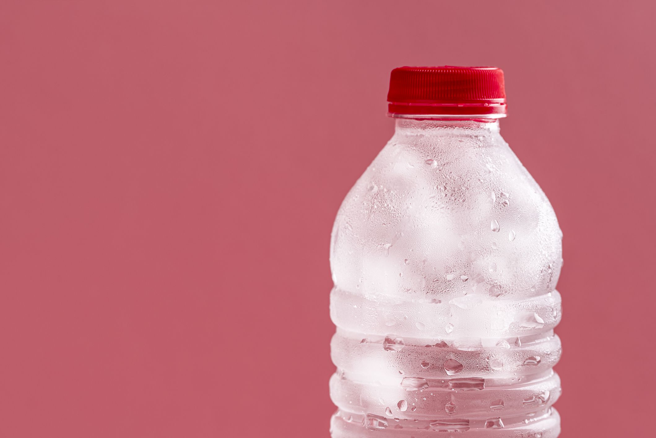 Water bottle with ice cubes in it.