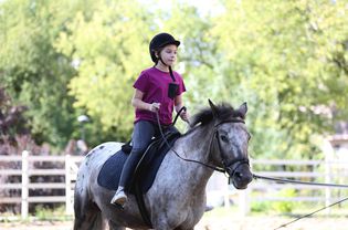 Girl riding pony